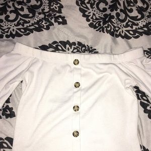 I am selling a white crop top with buttons
